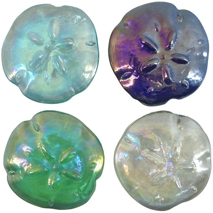 4 iridescent sand dollar shaped paperweights. 1 is dark blue, 1 is green, 1 light blue, 1 is white clear.