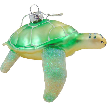green blown glass turtle ornament with glitter accents and a hand painted face.