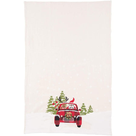 Tan towel with a red truck with Santa & reindeer in it.