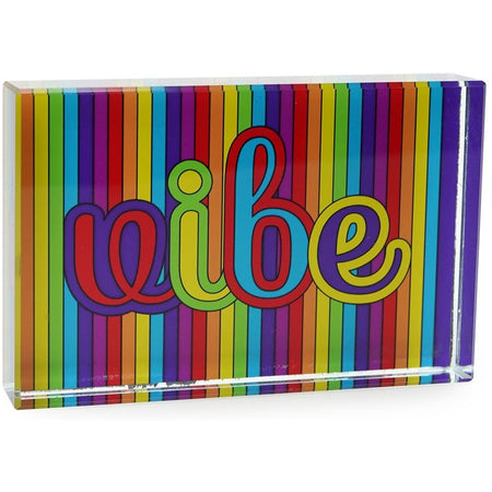Rainbow striped paperweight that says vibe.
