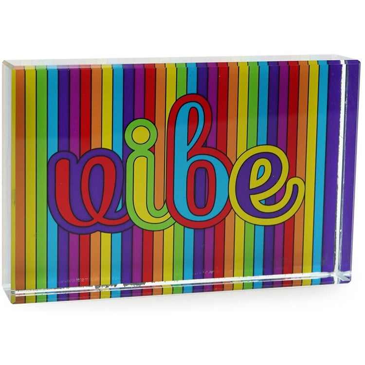 Rainbow striped paperweight that says vibe.