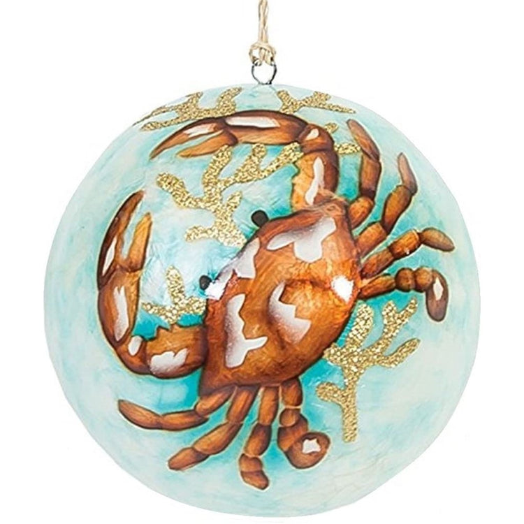 teal ball with orange crab & gold accents on it