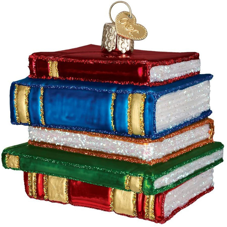 a blown glass ornament of a stack of five books, two red, one blue, one orange and one green.