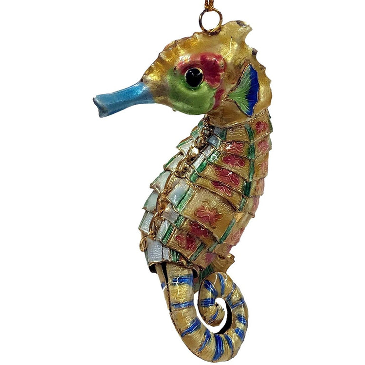 Yellow seahorse ornament with red green and blue accents 