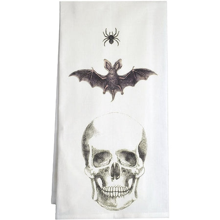 White towel with a skull, bat & spider on it.
