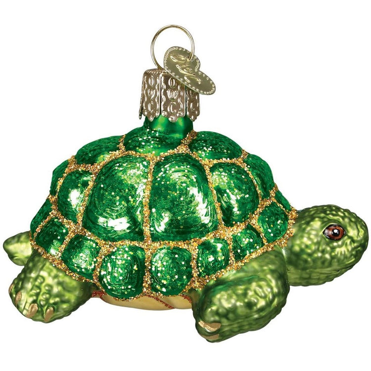 Green tortoise with glitter embellishments. 