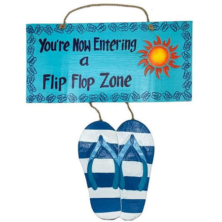 Teal painted sign that says "You're now entering a flip flop zone" with a hanging pair of flip flops.