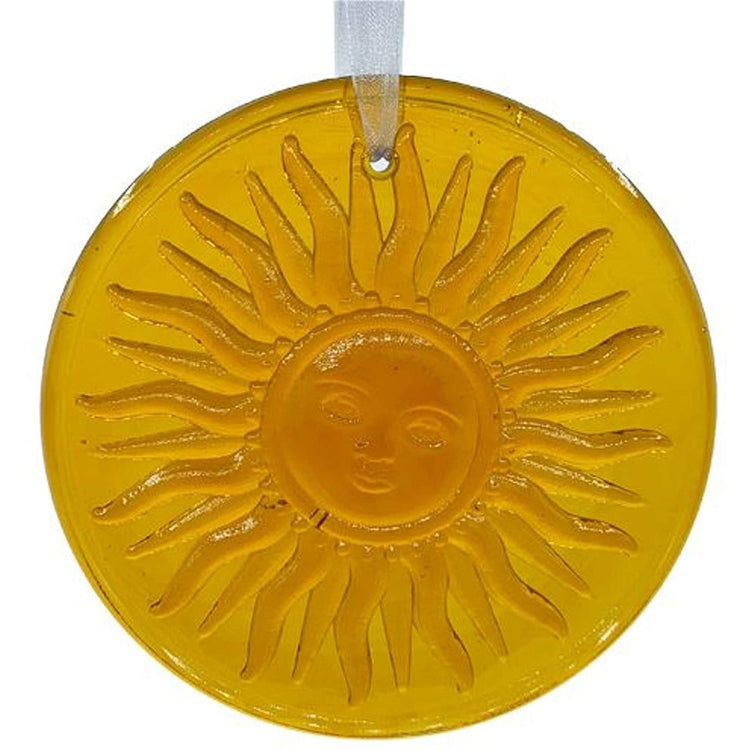 Yellow suncatcher with a smiling sun face on it.