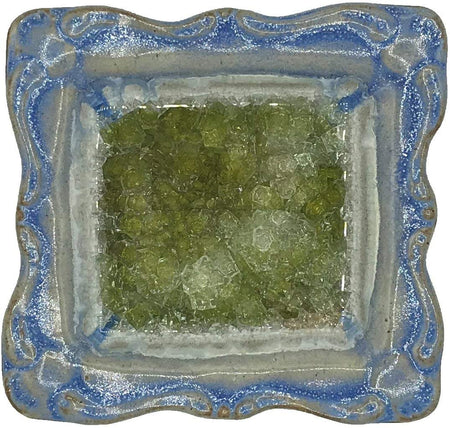 square pottery dish with blue glaze around the edge, and green in the middle.