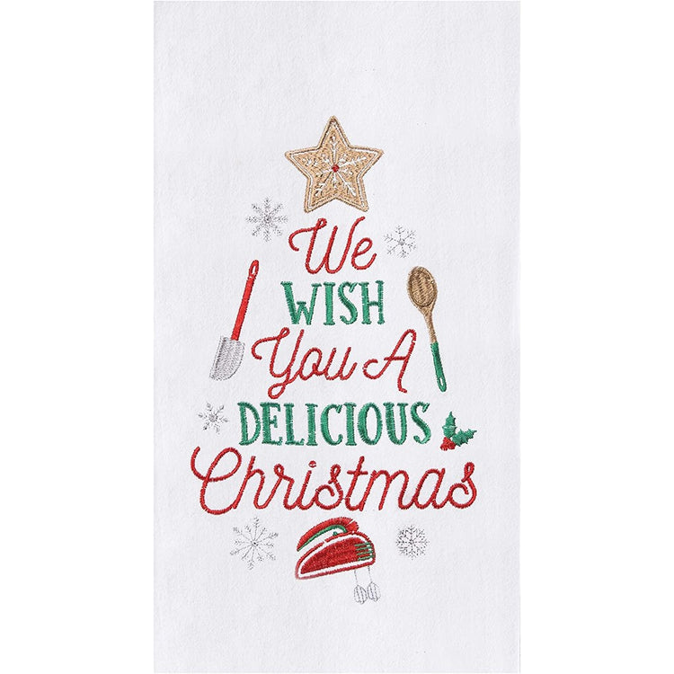 White towel that says "We wish you a delicious Christmas" and baking materials."