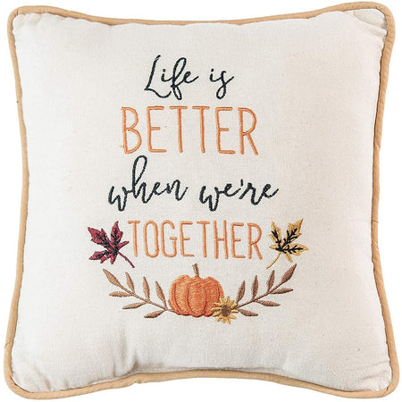 Tan pillow that says "Life Is Better When We're Together" with pumpkins.