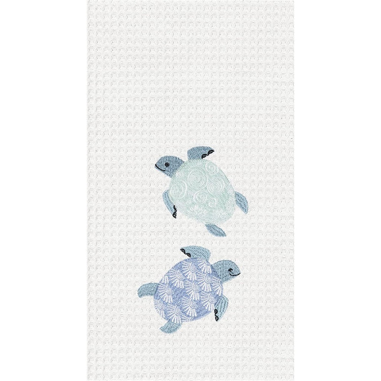 White waffle weave with light blue sea turtles embroidered on it.