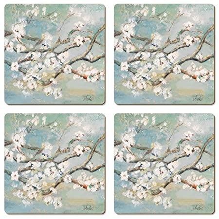 Four square coasters with a cherry blossom design over a watercolor blue background.