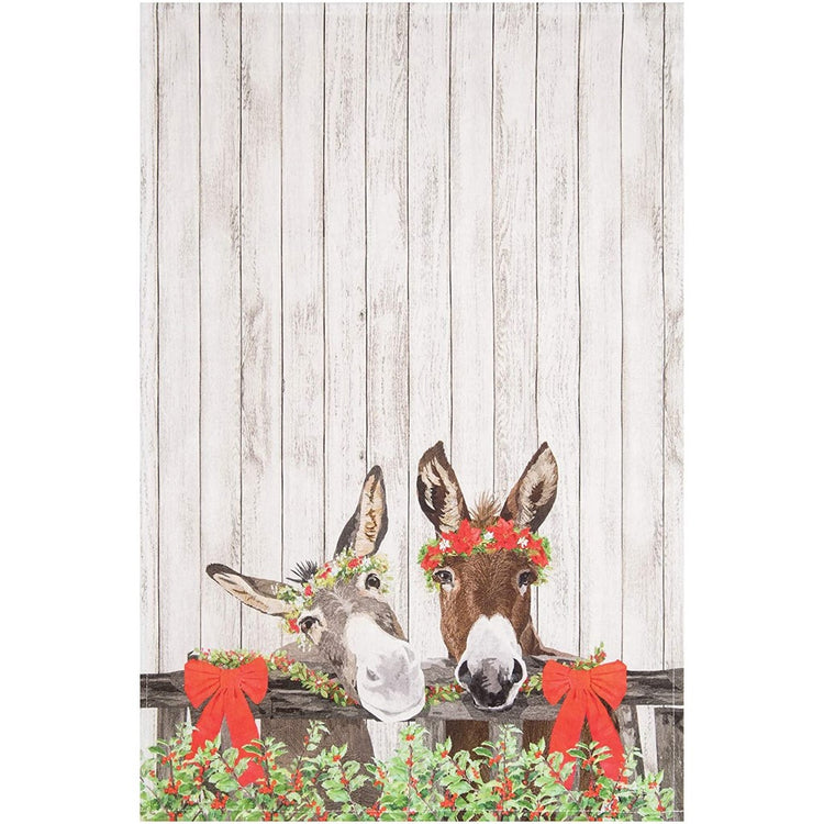 towel with two donkeys wearing holiday flower crowns, looking over a fence with red bows, the background looks like light colored wood slats.