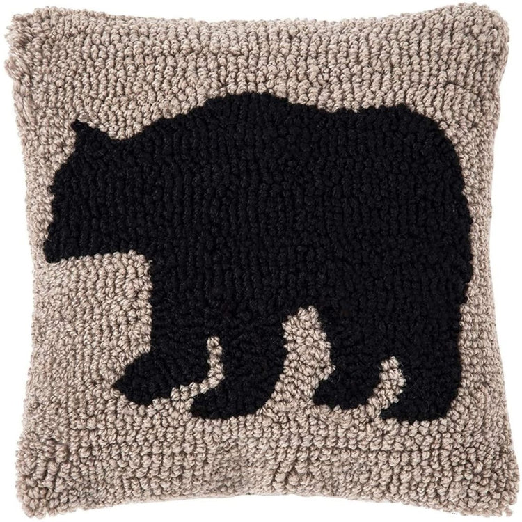 Square pillow featuring a black bear on tan background made with small knots
