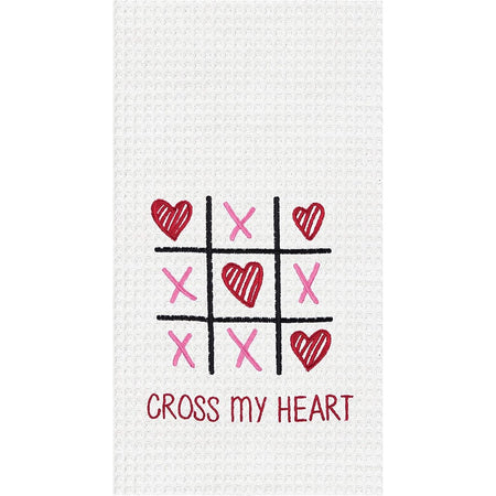 White waffle weave dishtowel has a tic tac toe design with pink x's and red hearts. says cross my heart.