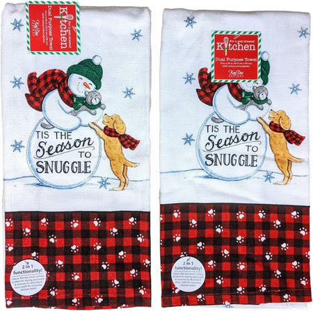 2 white terry cloth towels with a printed design of a snowman holding a grey cat, and a puppy jumping up, there is also a black and red plaid across the bottom with white paw accents. The phrase "tis the season to snuggle" is printed as well.