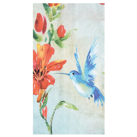 Folded dishtowel with blue humming bird next to red flowers.