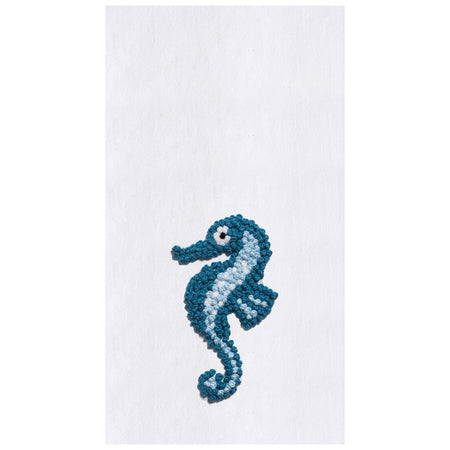 White flour sack kitchen towel embroidered with teal and blue seahorse.