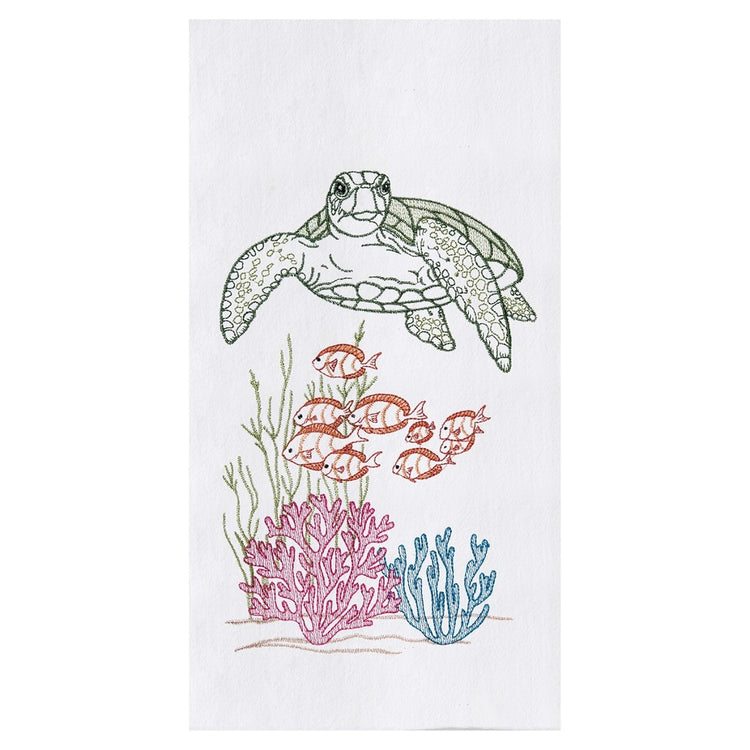 White towel, green turtle swims above school of gold fish, green, teal and pink coral below.