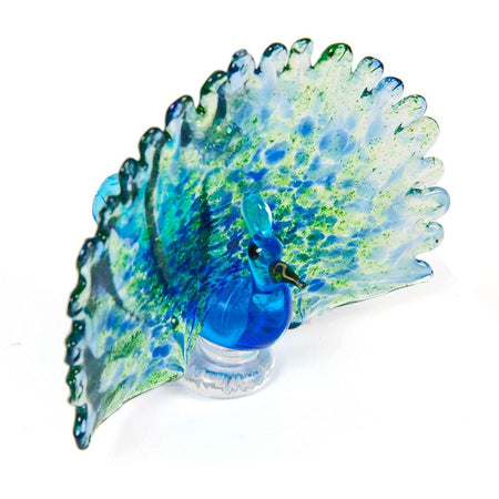 blue peacock with blue & green feathers & a black beak.