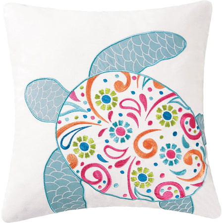 White pillow with pastel colorful sea turtle embroidered on front.
