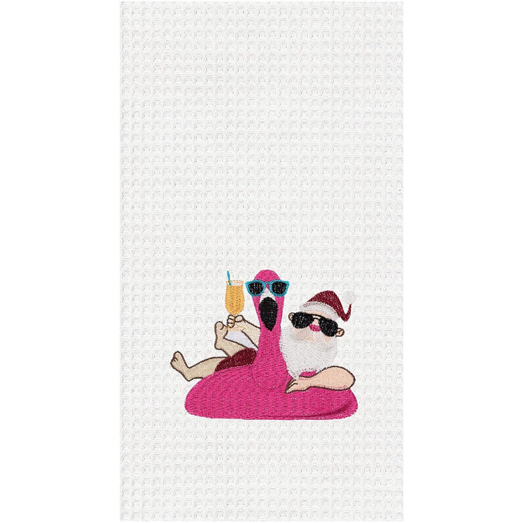 White waffle weave towel with embroidered Santa in a flamingo pool float.