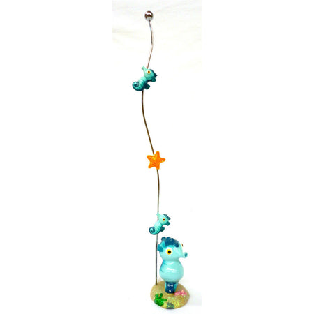 Seahorse on the beach figure with tall metal wire.  2 seahorse and 1 orange starfish magnets.