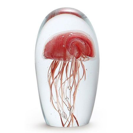 Clear orange/red jellyfish in a clear glass dome. Body of jellyfish at the top with legs going down.