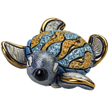Sea turtle shaped figurine with carvings and etchings. Blue, gold and silver.