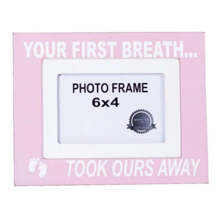 Light pink frame that says "Your first breath...took ours away".