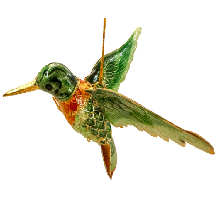 Hummingbird shaped ornament as if in full flight.  Gold color cord.  Hummingbird has a gold beak and green and orange wings and body with gold plated accents.
