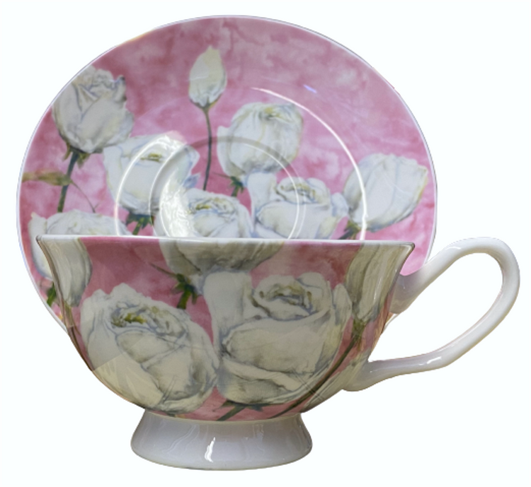 Light pink cup & saucer with white roses with light green stems on them.