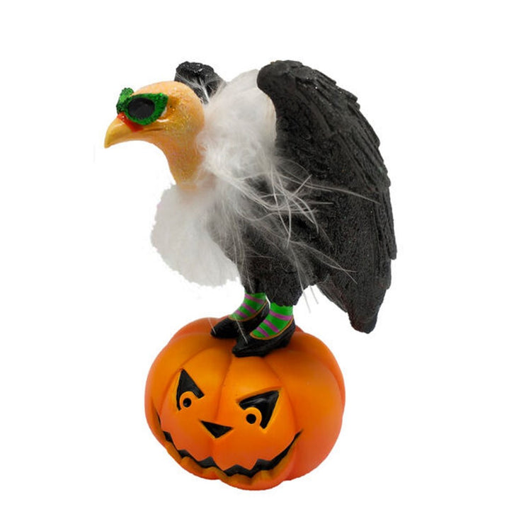 Vulture standing on a large jack o lantern. Vulture is in green and purple striped stockings and wearing glittery green sunglasses.