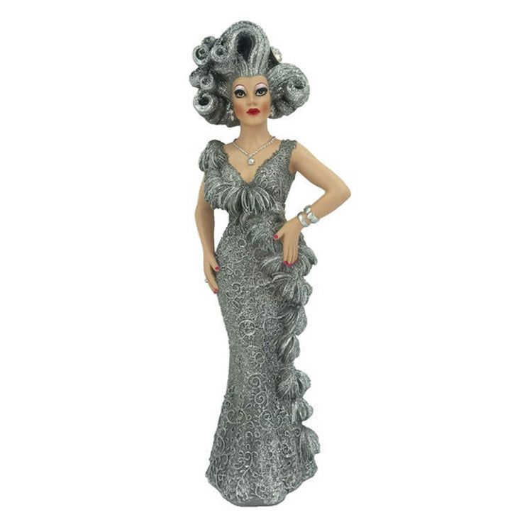 Drag queen figurine wearing long sparkling dress in gray, with gray hair.