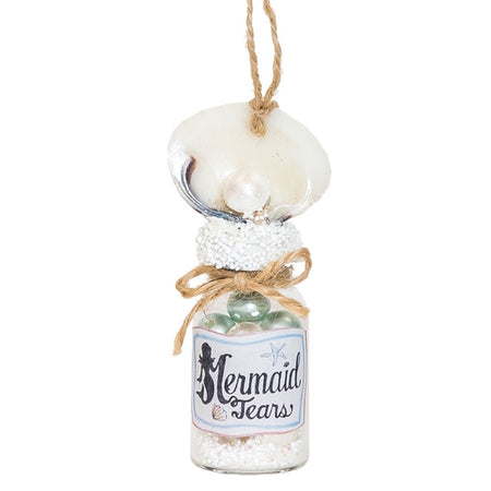 Clear bottle with pearl like filling and label "mermaid tears".