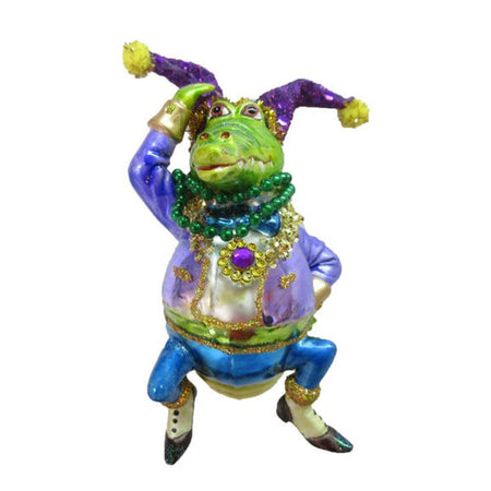 Alligator figurine ornament he is wearing mardi gras beads and hat.  Shades of purple and blue.