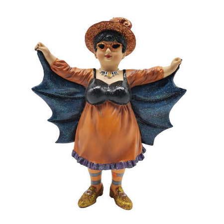 Witch with short black hair wearing orange glittery hat and sunglasses, orange dress with black bat wings and orange striped tights.