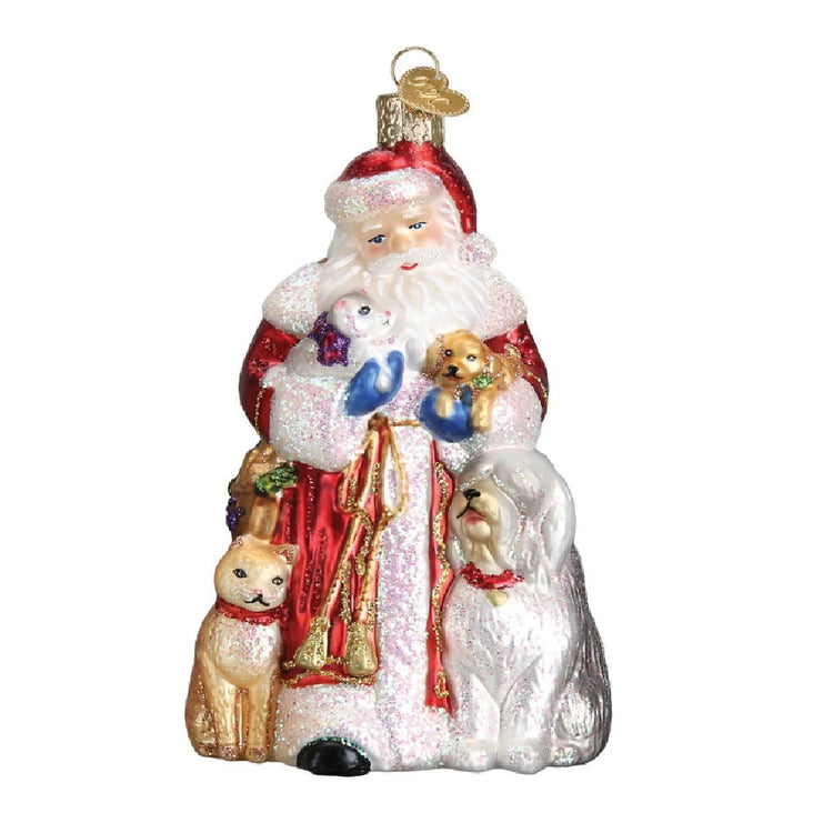 blown glass Santa ornament. Santa is holding a puppy and a kitten, and there is a cat and a dog by his feet.