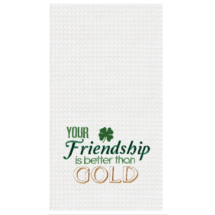 White waffle-weave towel that has a shamrock & says 'your friendship is better than gold' in green & gold stitching.