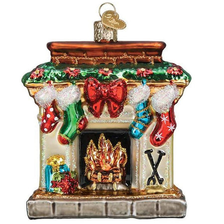 blown glass hanging ornament of a fireplace hearth decorated for the holiday with garland and stockings.