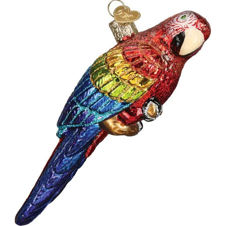 Blown glass tropical parrot ornament, the parrot is red, yellow, green and blue with gold glitter accents.