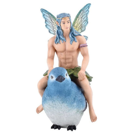resin ornament of a male fairy with blue hair and wings sitting atop a blue wren bird.