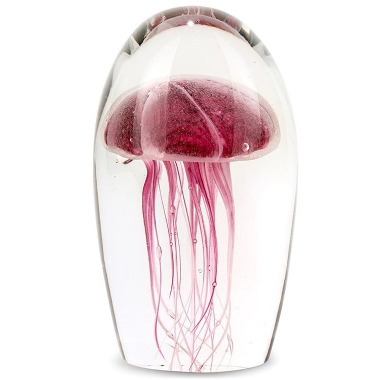blown glass jellyfish paperweight, magenta glow in the dark.