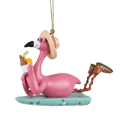 Pink flamingo hanging ornament, the flamingo is laying on a surfboard with a drink in its hands.