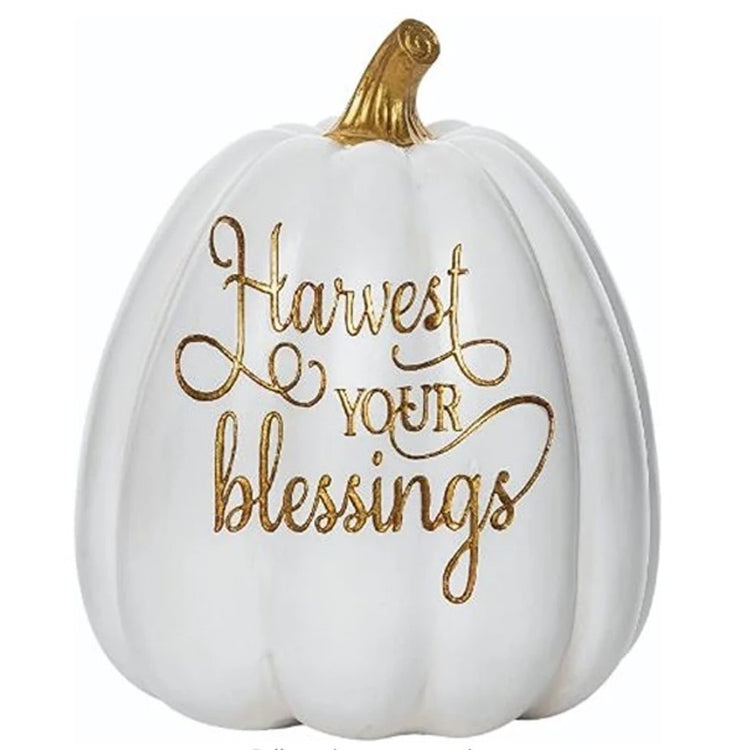 White pumpkin that says Harvest Your Blessings. 