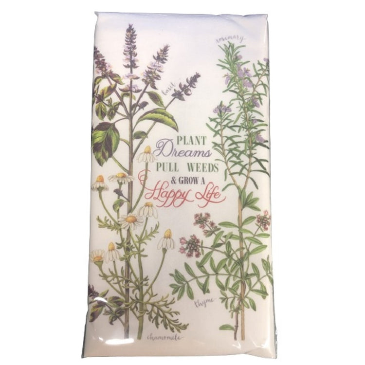 white towel with basil, rosemary, chamomile and thyme, says "plant dreams, pull weeds, grow a happy life"