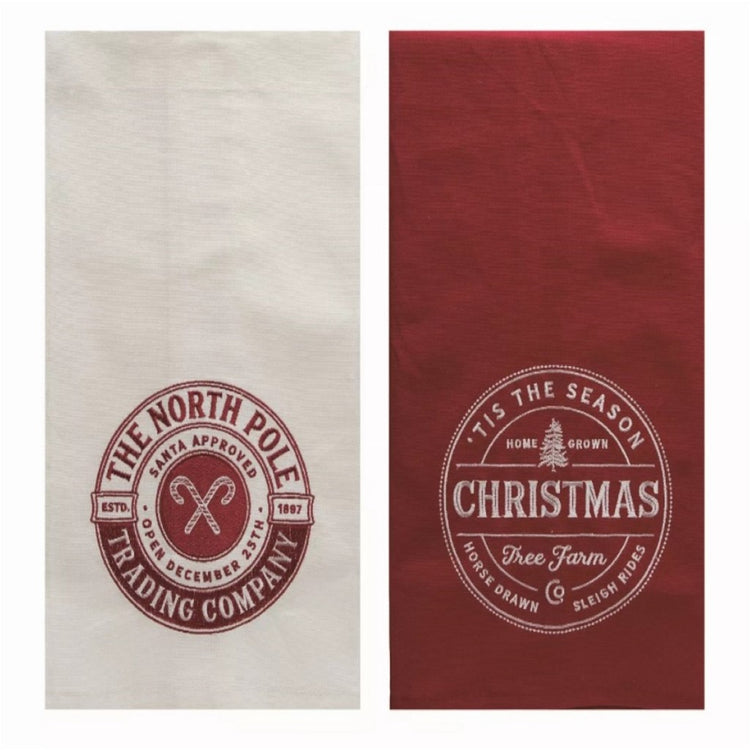 1 red Christmas tree farm towel, 1 white Northpole trading company towel.