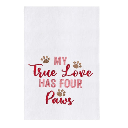 white flour sack towel with pink and red embroidered phrase "my true love has four paws." There is also three light brown embroidered paw prints.