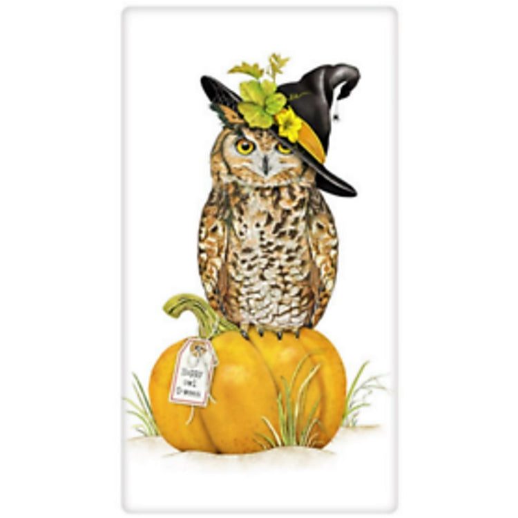 White towel with brown owl wearing witches hat and sitting on a pumpkin.